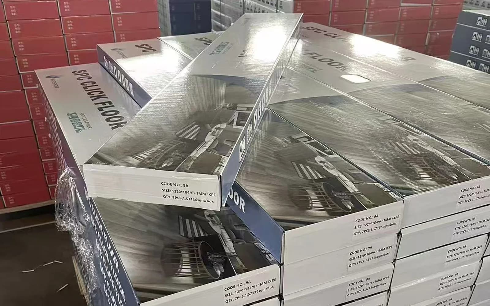 Private label SPC flooring cartons stacked on pallets for distributor supply