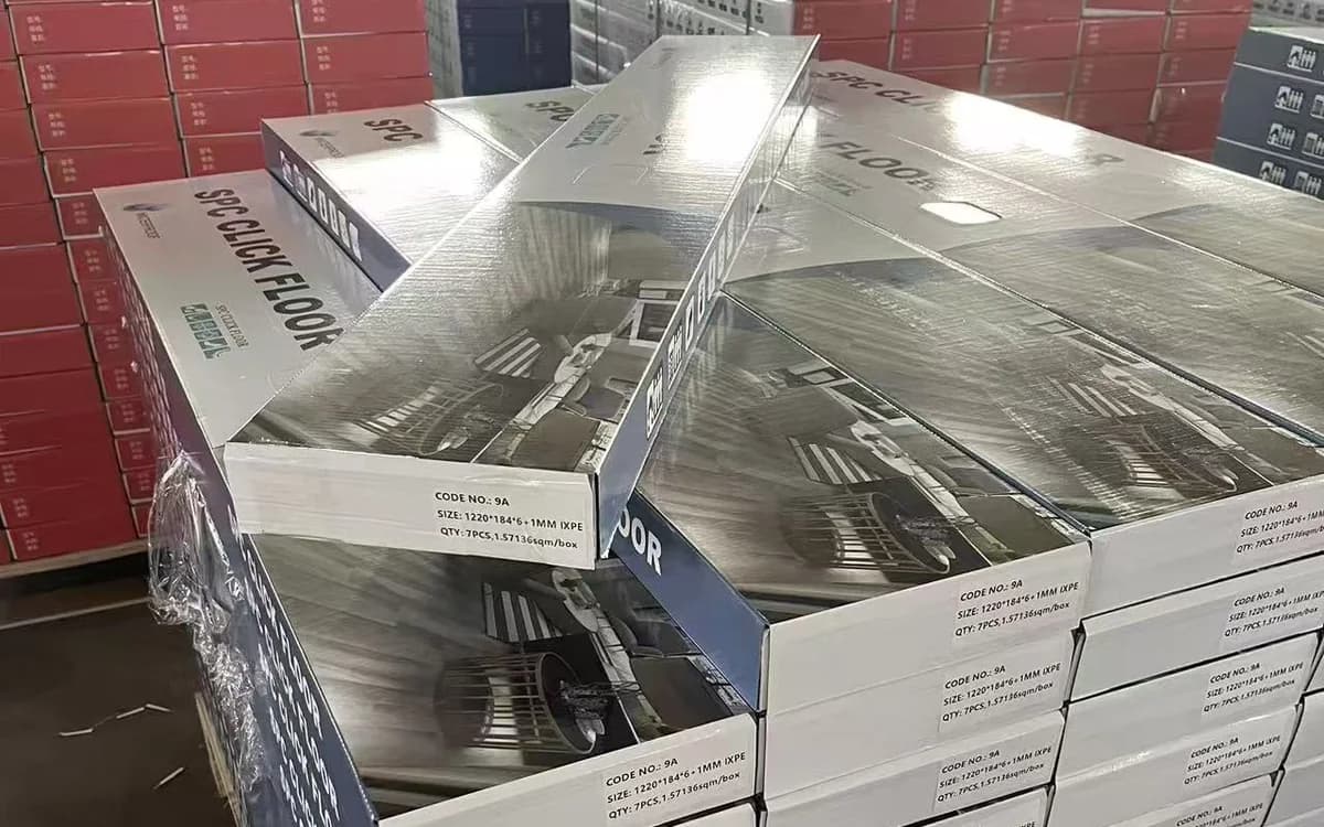 Private label SPC flooring cartons stacked on pallets for distributor supply